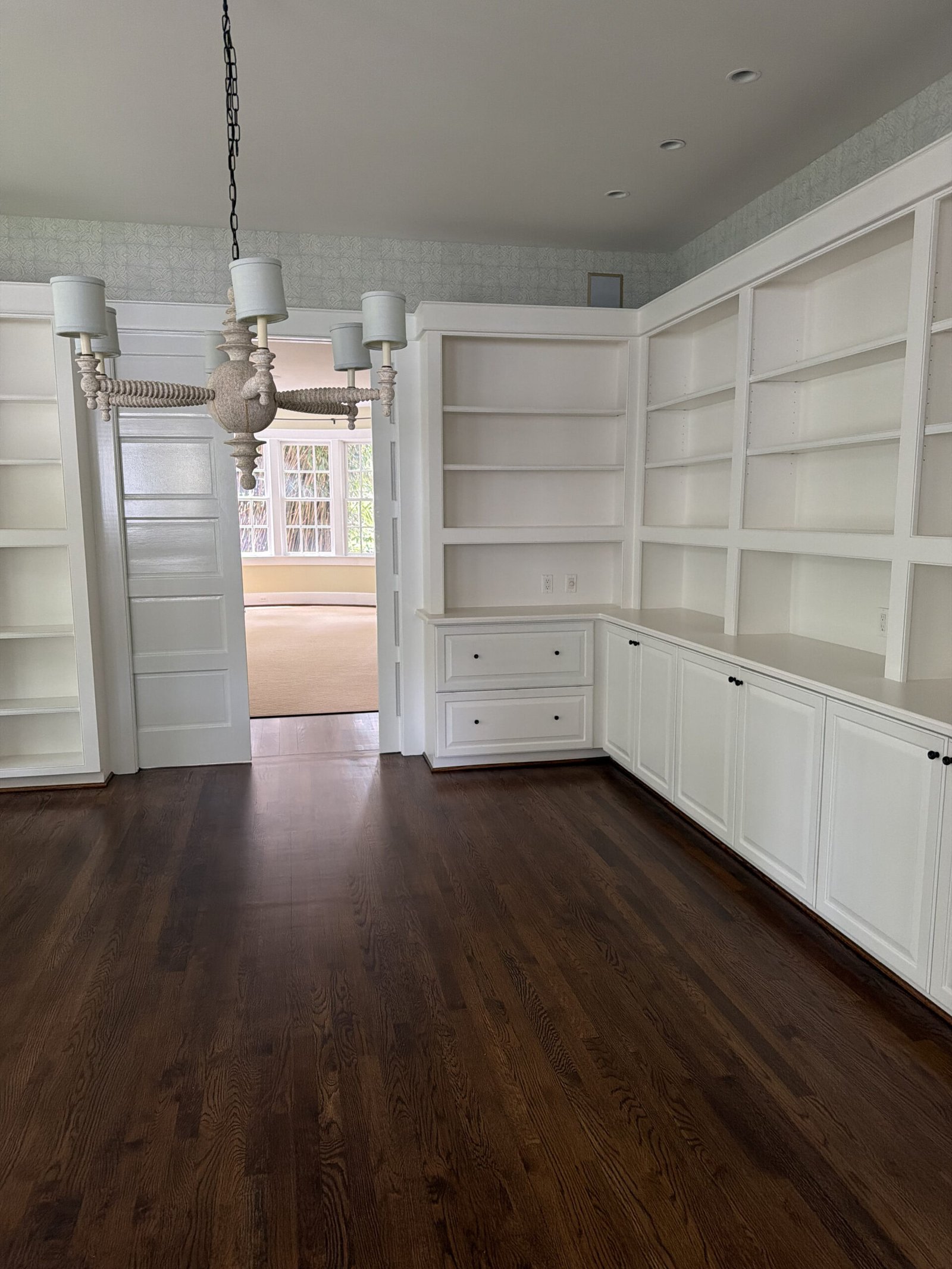 McLean estate built-in library with dark hardwood floors